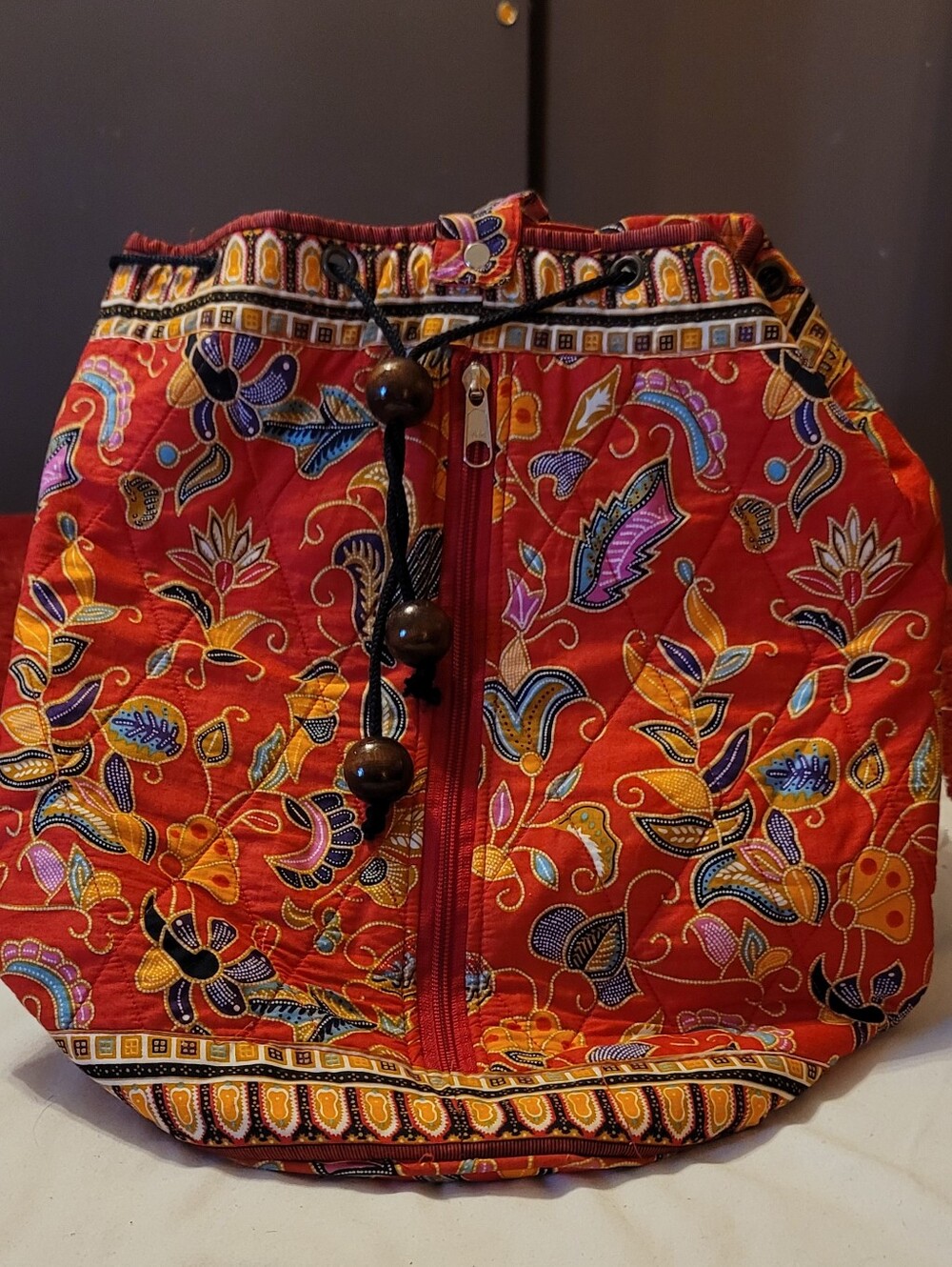red multi colored drawstring bah